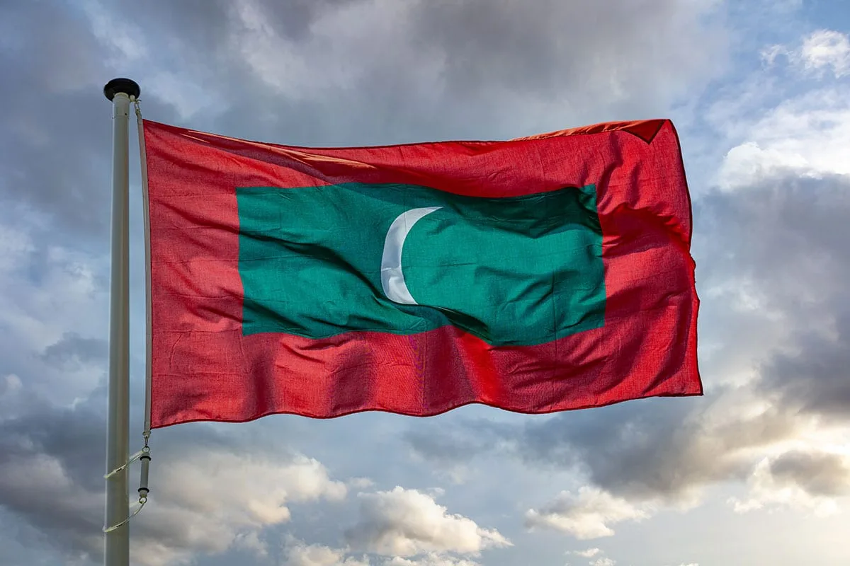 Maldives Flag Waving Against Cloudy Sky